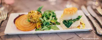 A plated dinner course at a catered reception