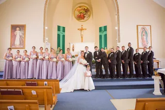 A full wedding party gathered outside the church